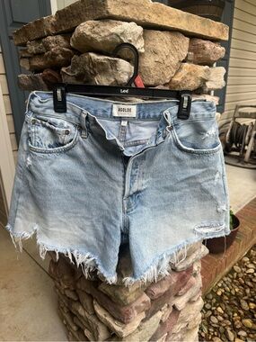 Agolde Light Blue Distressed Raw Hem Denim Shorts